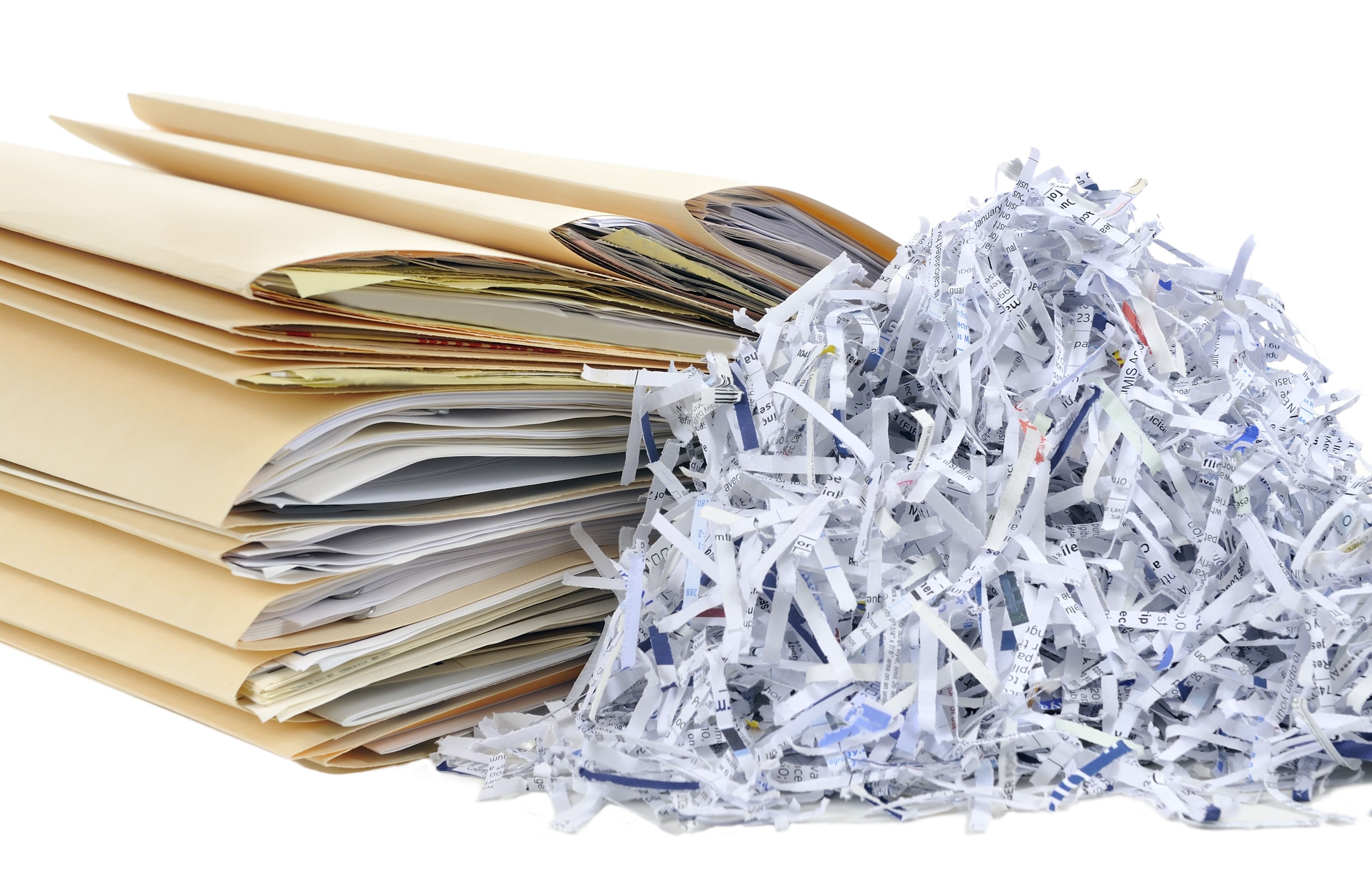 stack of documents in file folders, shredded paper pile
