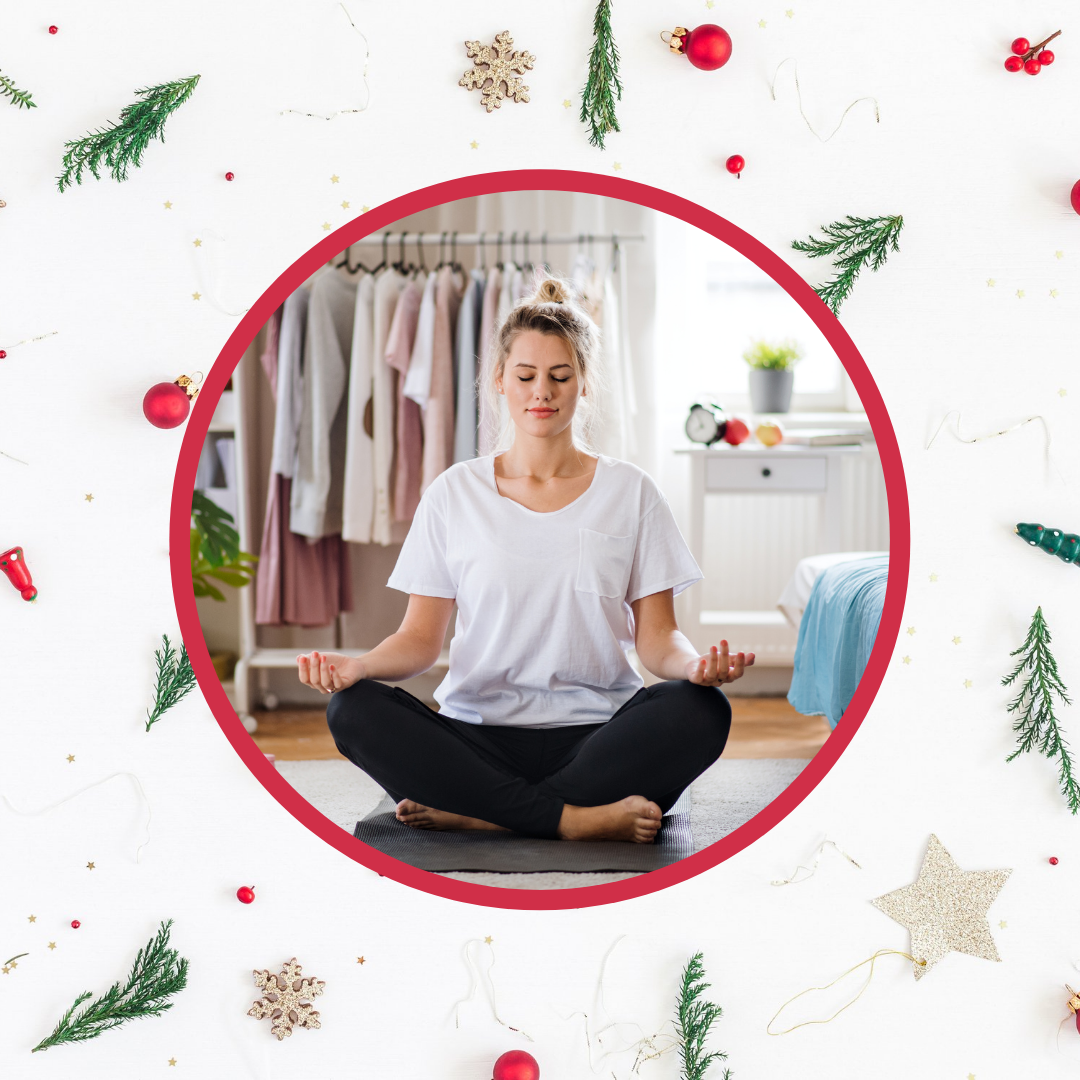 woman doing yoga in bedroom with festive holiday background