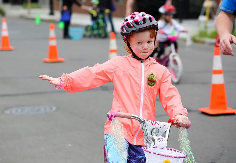 girl learning bike safety