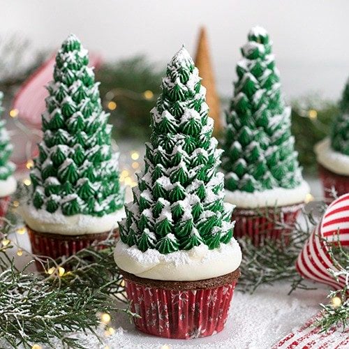 cupcakes with icing evergreen trees on top