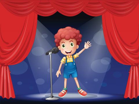 Child on stage with microphone.