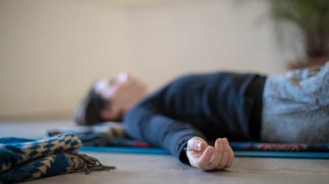woman performing yoga nidra 
