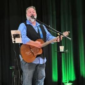 A photo of performer Tom Donovan in concert